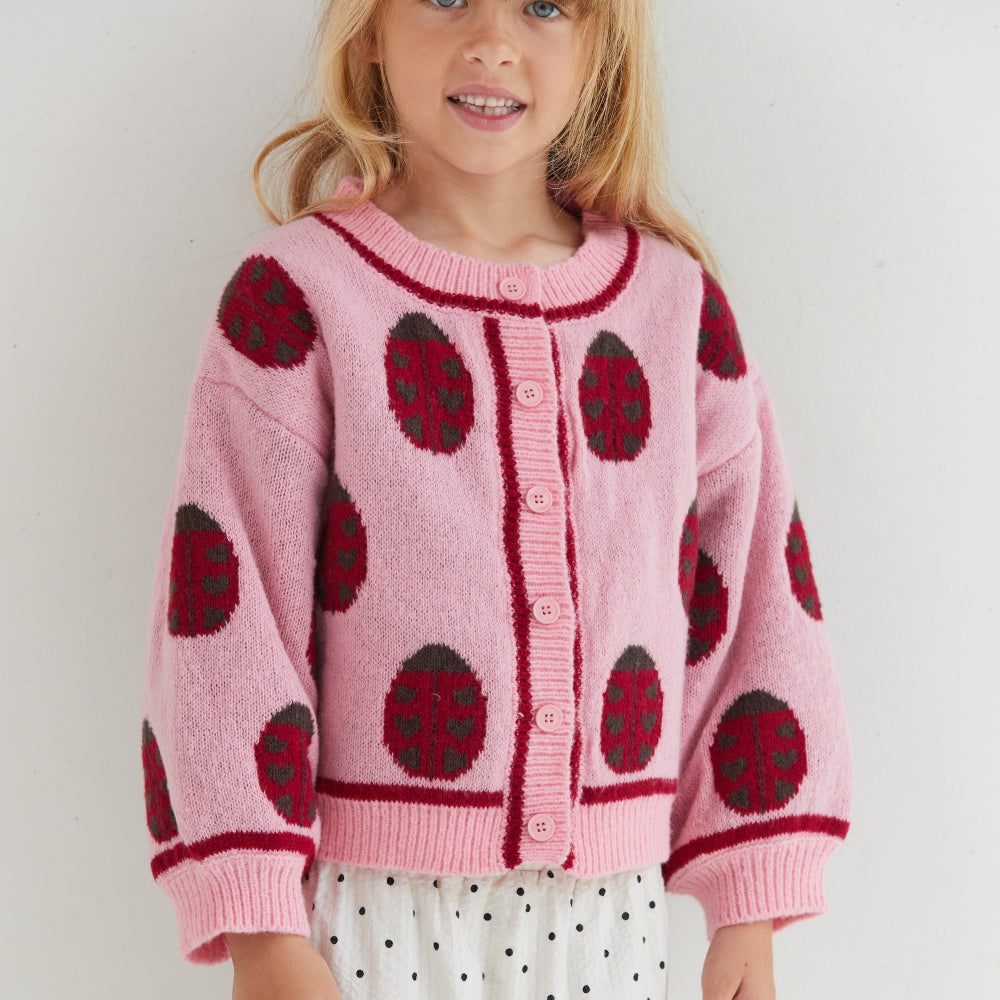 Rose lovebug cardigan van eht merk Juni aan bij meisje dichtbij